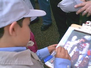 jr signs an autograph