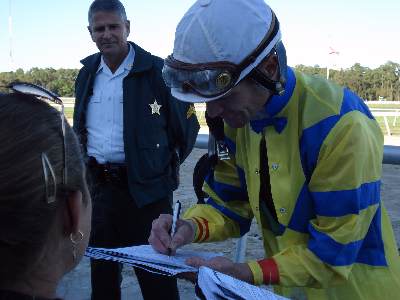 Calvin Borel signs an autograph