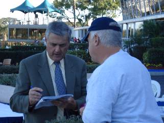 Carl Nafzger signs an autograph