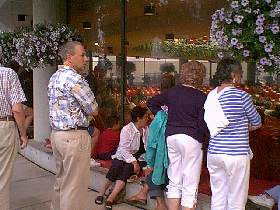 Onlookers peer into the pavilion